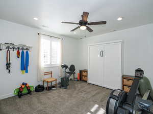 Miscellaneous room with ceiling fan and carpet