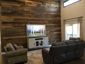 Living room with wood walls