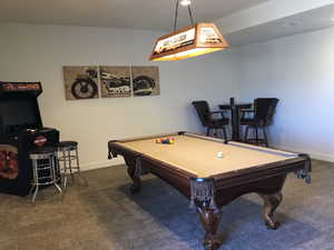 Recreation room with carpet floors, pool table, and baseboards