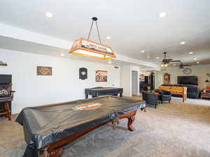 Playroom with carpet floors, pool table, and ceiling fan