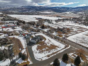 Snowy aerial view featuring a mountain view