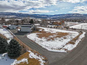 Snowy aerial view with a mountain view