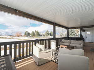 Wooden terrace featuring an outdoor hangout area