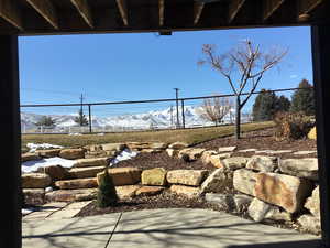 Exterior space with fence and a mountain view