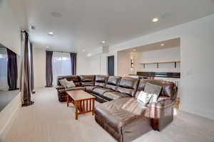 Living room featuring light carpet