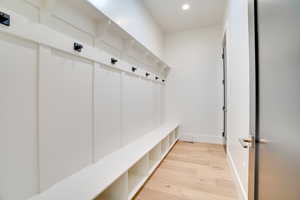 Mudroom with light hardwood / wood-style flooring