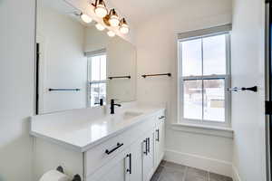 Bathroom featuring vanity and tile patterned flooring