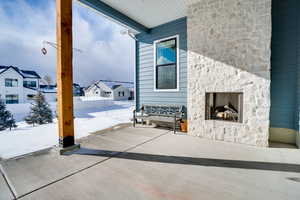 View of patio / terrace with an outdoor stone fireplace