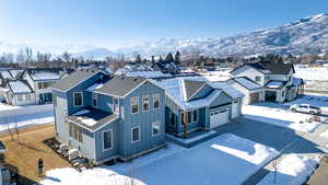 Snowy aerial view with a mountain view