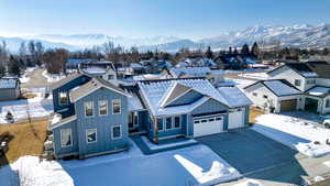 View of front of home featuring a mountain view and a garage