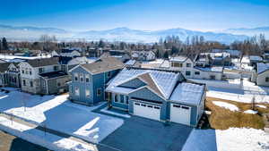 Snowy aerial view with a mountain view