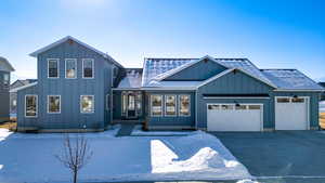 View of front of property featuring a garage