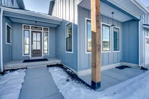 View of snow covered property entrance