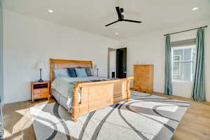 Bedroom featuring ceiling fan and light hardwood / wood-style floors