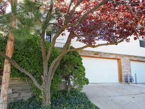 View of side of home with a garage