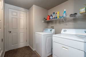 Laundry area featuring carpet floors and washer and dryer