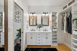 Primary Ensuite Bathroom featuring vanity, bamboo wood-style floors, and shiplap walls