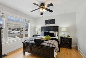 Primary Bedroom with ceiling fan and bamboo wood-style floors