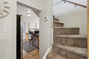 View of staircase leading to flex space...use as a den, play room, workout space or office