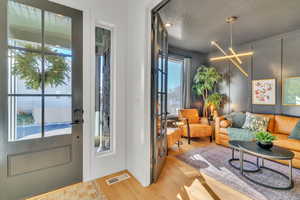 Interior space featuring light hardwood / wood-style floors and a textured ceiling