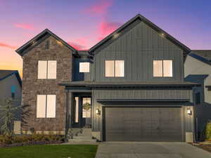 View of front facade featuring a garage