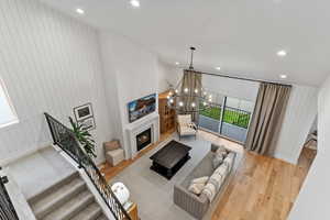 Living room featuring a notable chandelier and light hardwood / wood-style floors