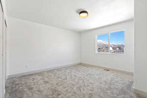 Empty room featuring carpet flooring