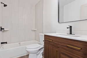 Full bathroom with shower / bathtub combination, toilet, and vanity