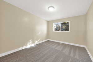 Bedroom 3 - Empty room featuring carpet floors