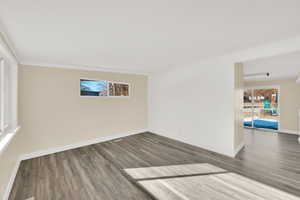 Unfurnished room with hardwood / wood-style flooring