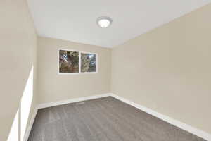 Bedroom 1 - View of carpeted spare room