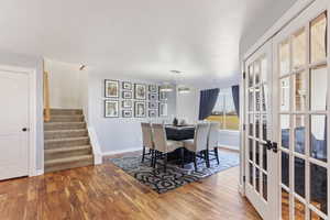 Entry Area with home office/den glass french doors and formal dining area