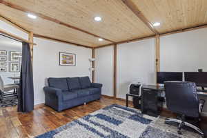 Large Home office/den area with hardwood flooring and wooden ceiling