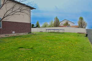 View of yard featuring a fenced backyard