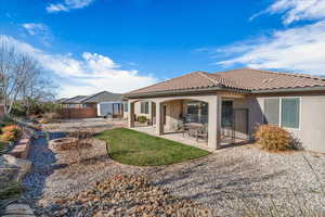 Back of property featuring a patio area