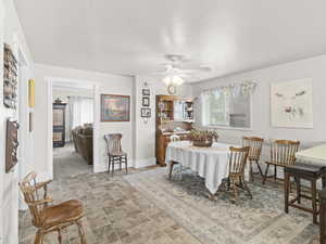 Dining area with ceiling fan