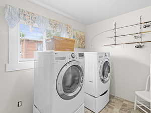 Clothes washing area with washer and clothes dryer