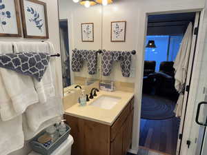 Jack & Jill style Bathroom featuring vanity, toilet, and shower.