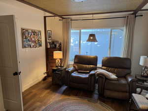 Living area featuring engineered hard wood.  This room is currently being used as a TV room, but it would be a bedroom, or office, or craft room, etc