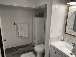 Bathroom featuring toilet, vanity, and shower right off the bedroom, could be a master suite.