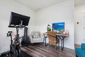 Exercise room with wood-type flooring