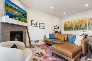 Living room with a tile fireplace