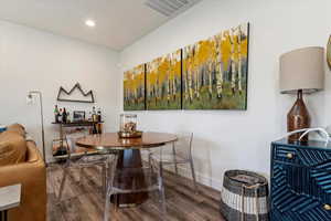 Dining area with hardwood / wood-style flooring