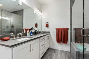 Bathroom with vanity and separate shower and tub