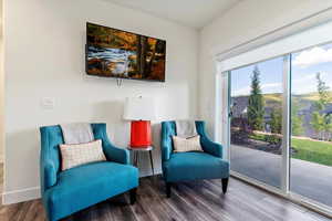 Sitting room with wood-type flooring