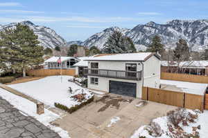 Exterior space featuring a mountain view and a garage