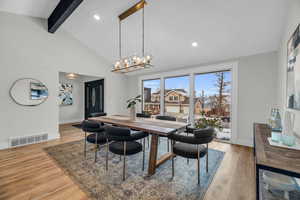 Dining area with expansive windows, vaulted ceiling, modern finishes and valley views