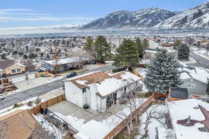 Snowy aerial view with a mountain view