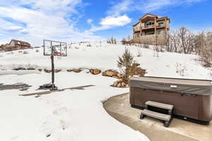 Exterior space with a hot tub