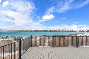 Wooden terrace with a water and mountain view